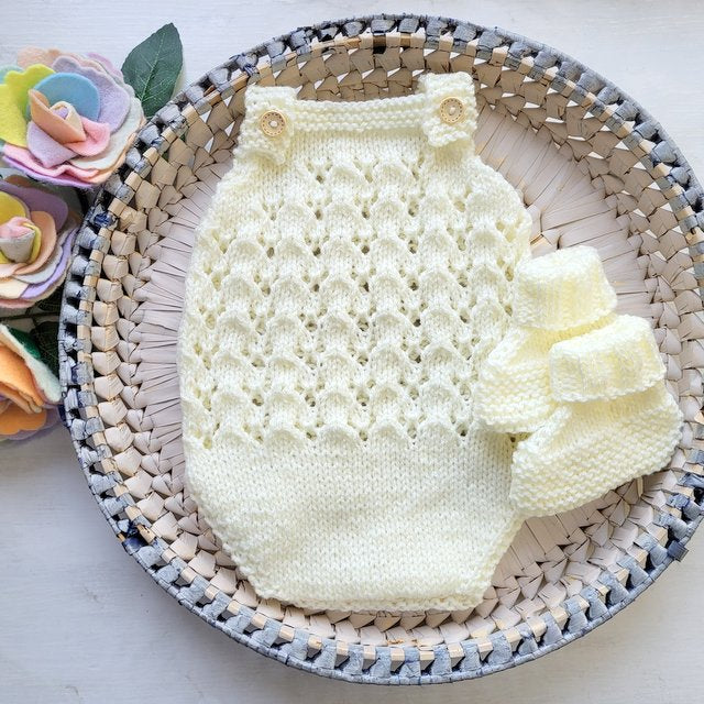 cream knitted lace baby romper with matching booties