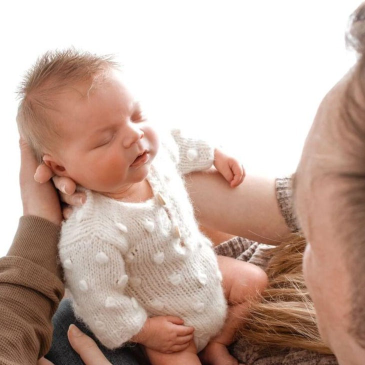handknit baby romper with popcorn bubble pattern for newborn photo prop