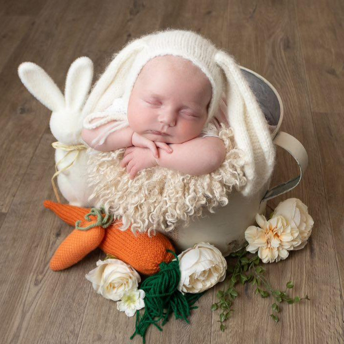 hand knit baby bunny bonnet with long floppy ears, ideal as a newborn photography prop or as a gift for a babys first Easter