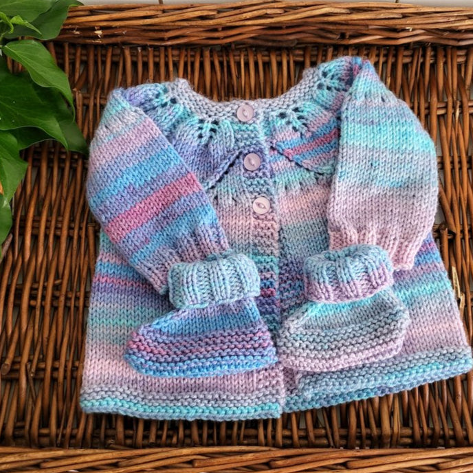 handknit baby girl jumper with leaf pattern and matching booties
