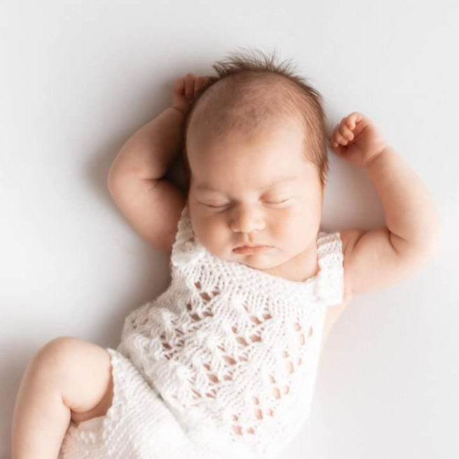 lacy romper for a newborn baby girl