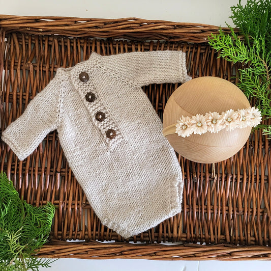 beige knitted newborn romper with short sleeves, plus matching cream headband