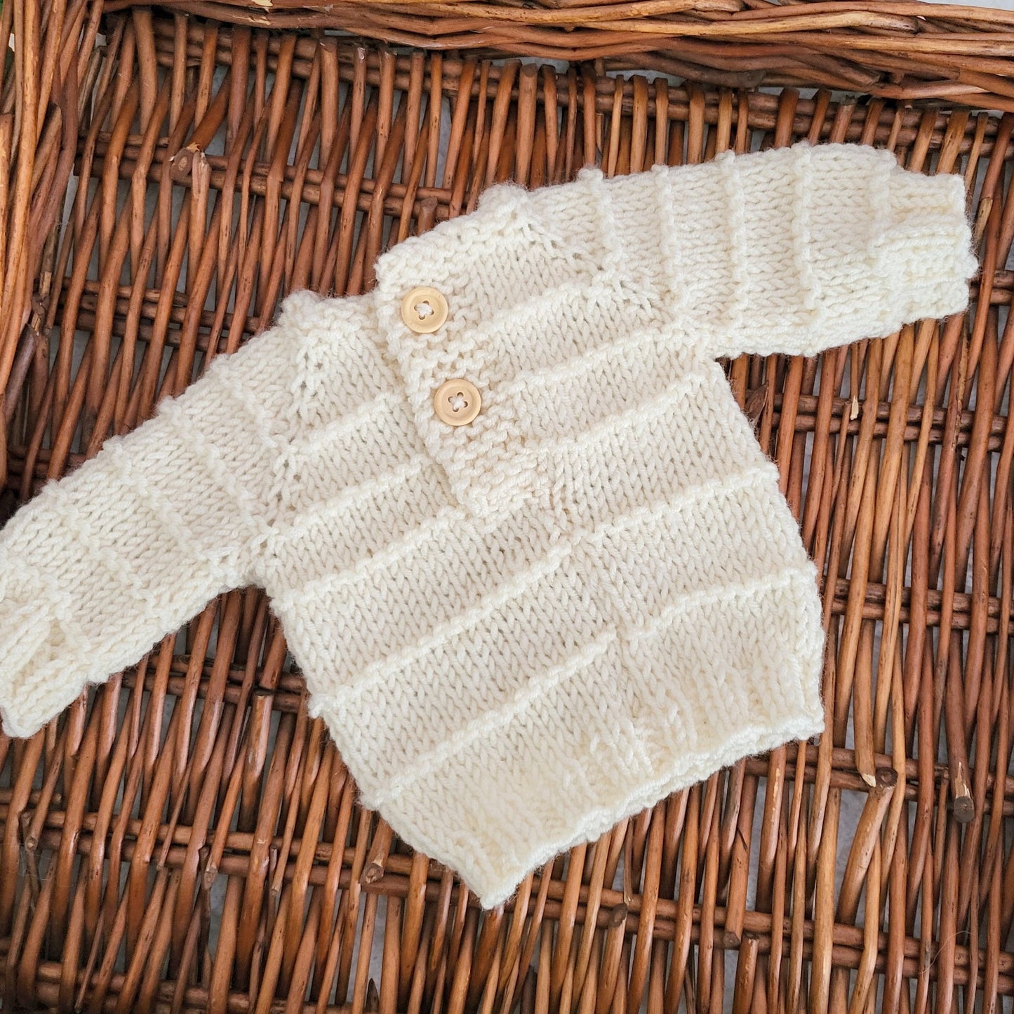 cream knitted baby sweater