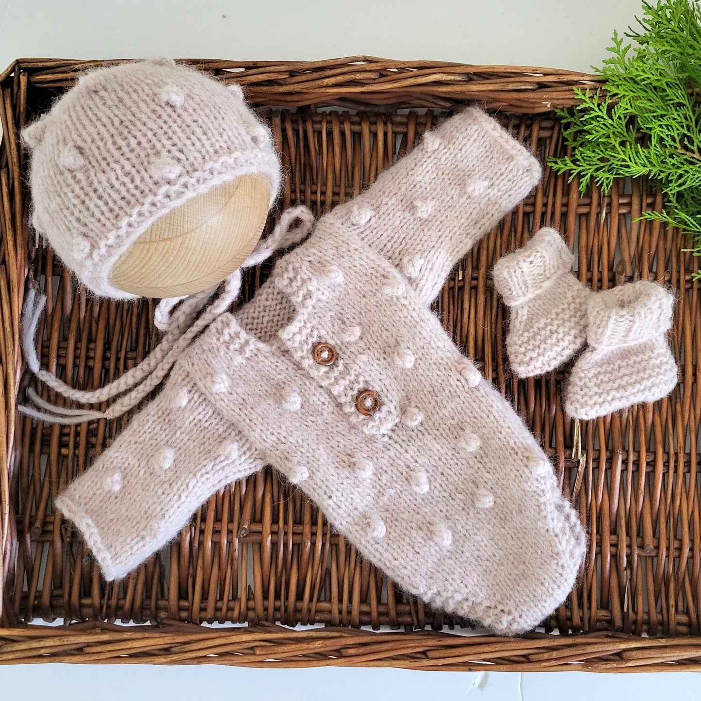 pale blush pink knitted long sleeve romper with matching hat and booties for a baby girl photo prop or stork tea gift