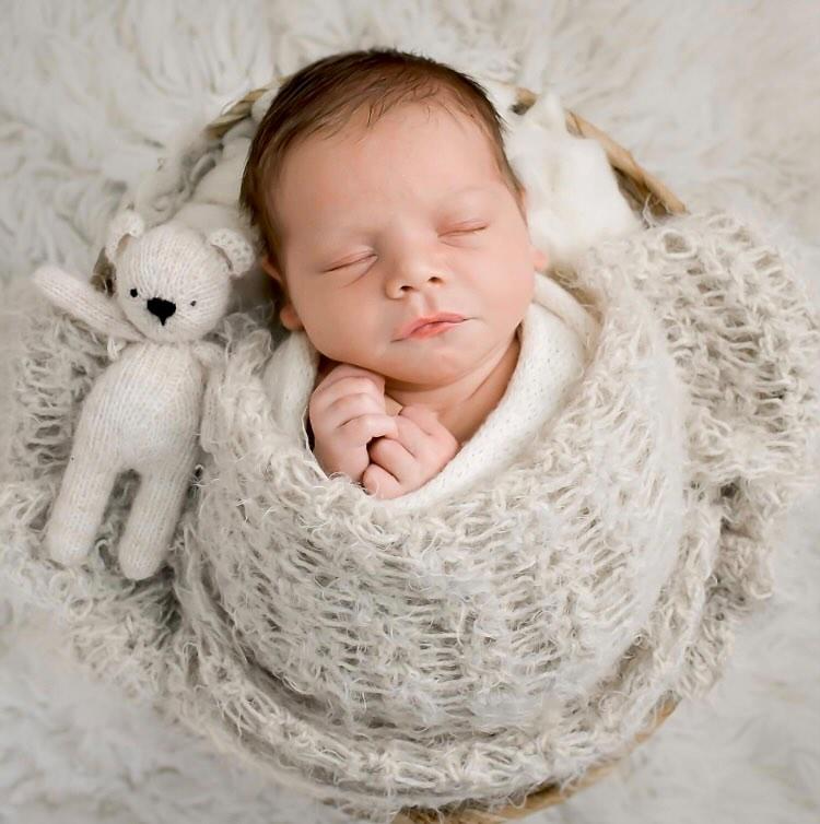 collection of newborn knit wraps and blankets