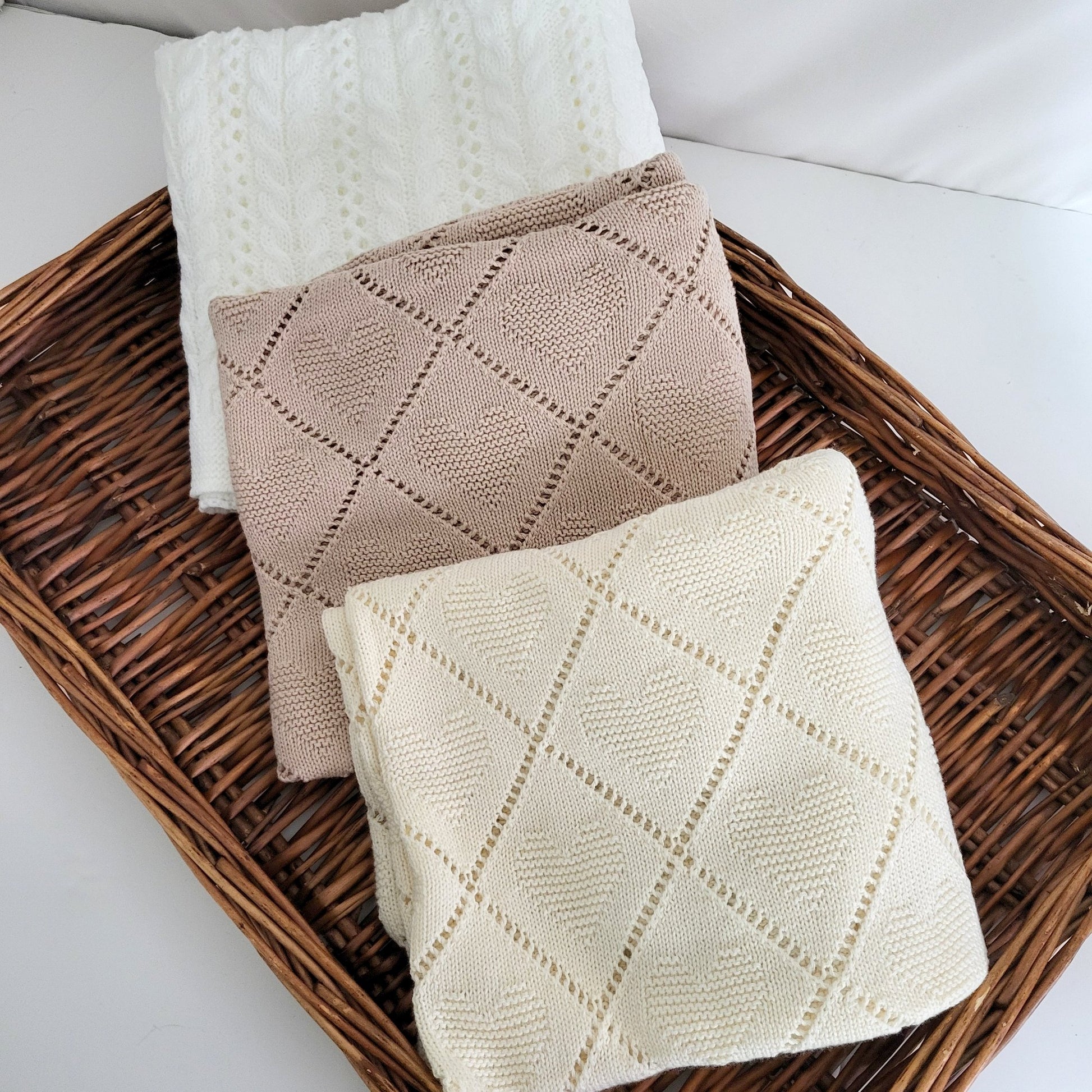 whjite beige or cream knitted baby blankets for swaddling a newborn baby, receiving blanket, cellular blanket