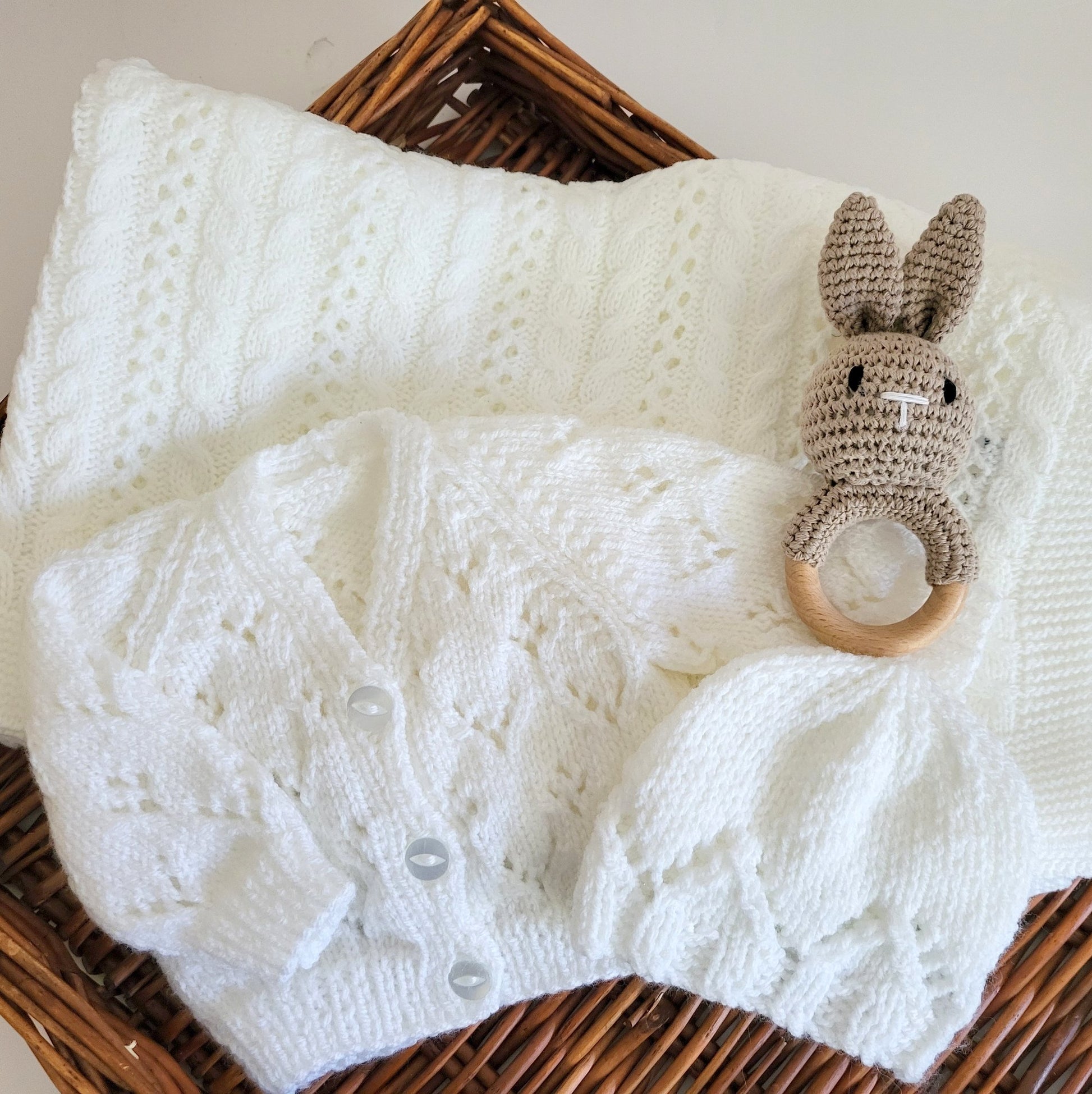 handknit baby gift set , white knitted baby jumper with matching hat and a white baby blanket pluse a toy bunny rattle