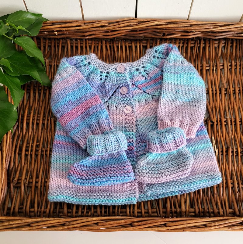 handknit baby girl jumper with leaf pattern and matching booties