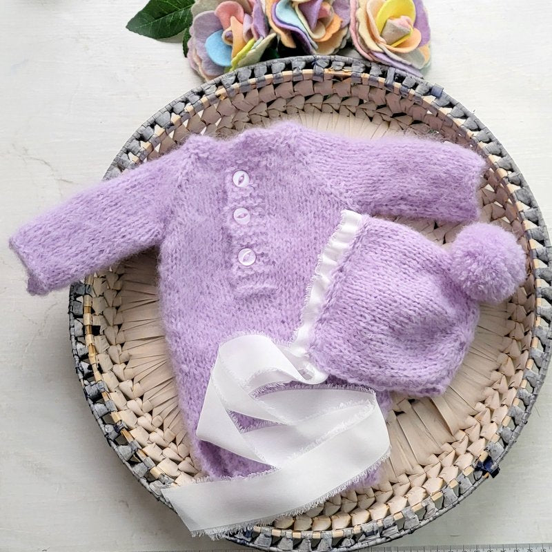 baby girl photo prop knit in lavender alpaca yarn, with long sleeves and a matching pom pom ribbon bonnet