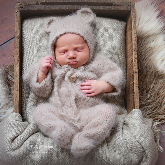 beige knitted footed bear suit and bonnet for newborn photo shoots