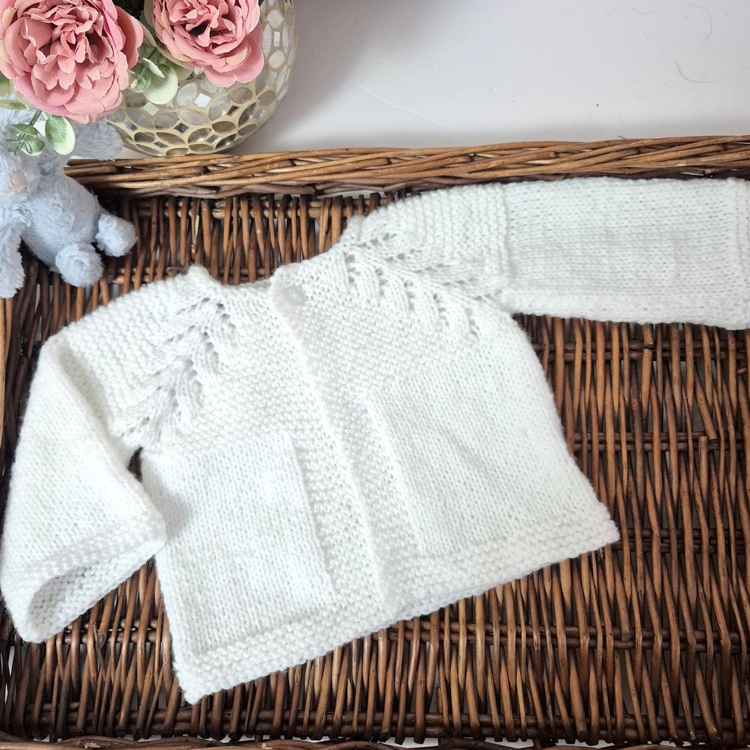 Handknit baby cardigan with norweigan fir pattern
