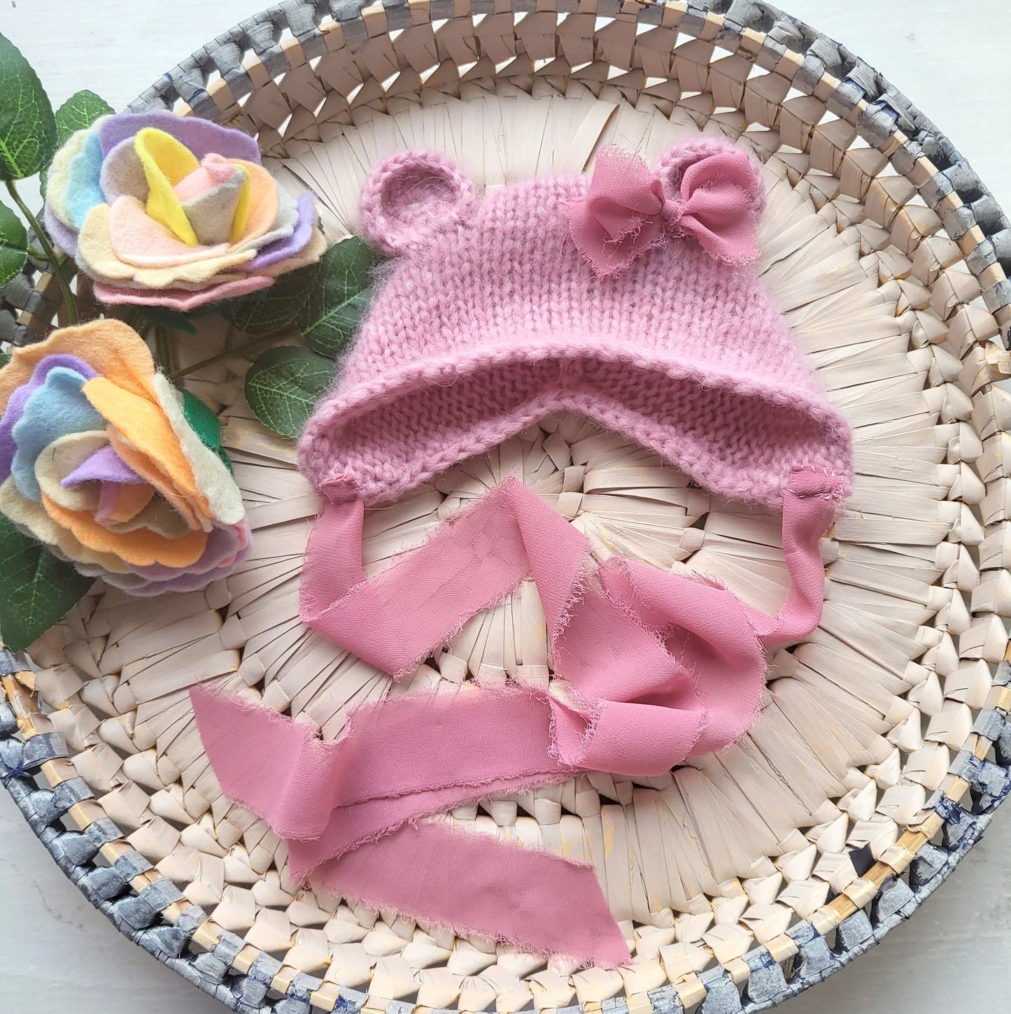 pink baby bear bonnet with bow and frayed ribbons