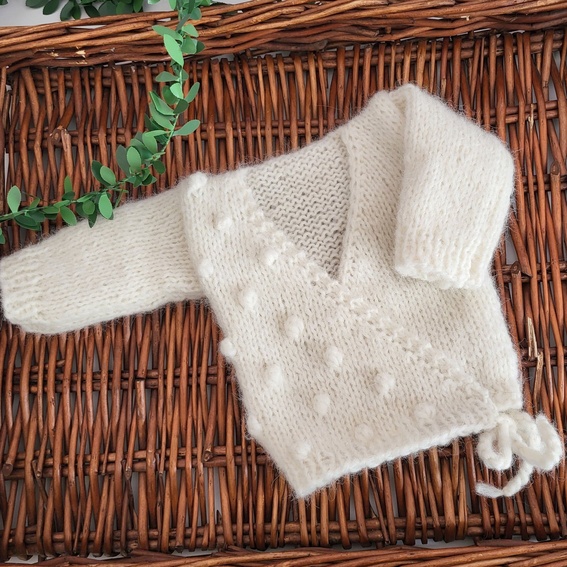 knit baby cross over jumper with popcorn bobbles
