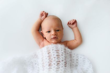 white fluffy crochet newborn wrap layer for photo shoots