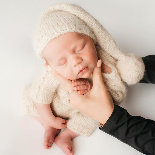 knitted sleepy cap with pom pom for babies
