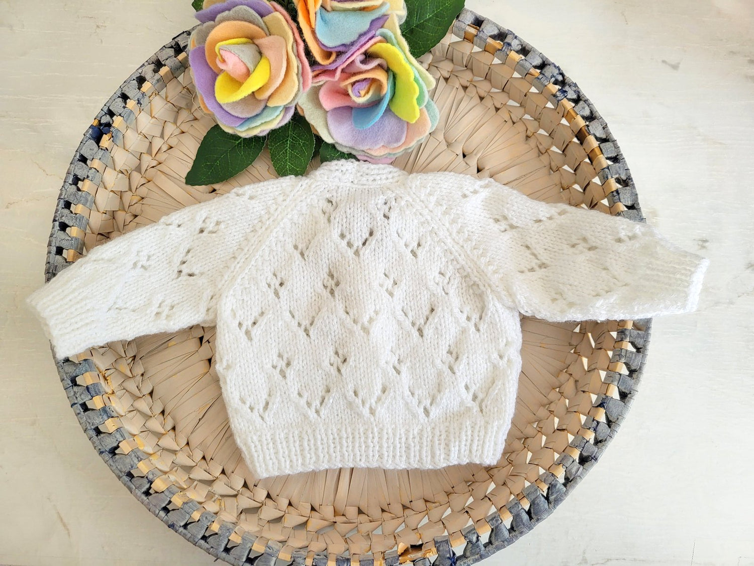 knitted baby cardigan in white