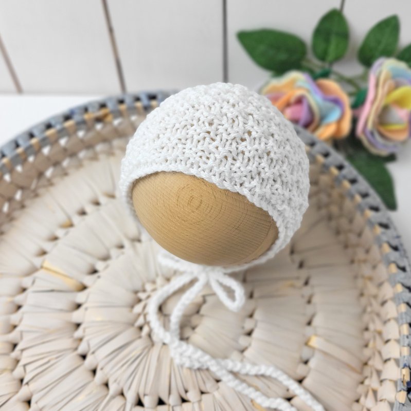 knit newborn bonnet in white