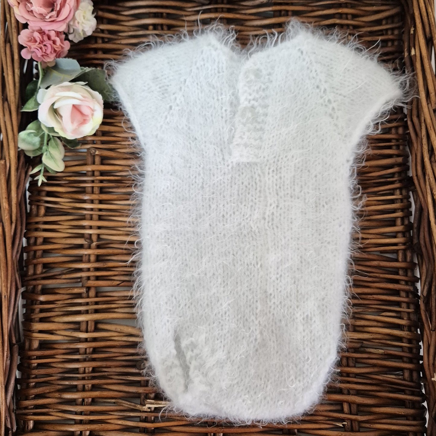 RTS ready to send knitted newborn photography prop romper. Hand made in super soft and fluffy white yarn. The romper is short sleeved, perfect for summer photo shoots.&nbsp;