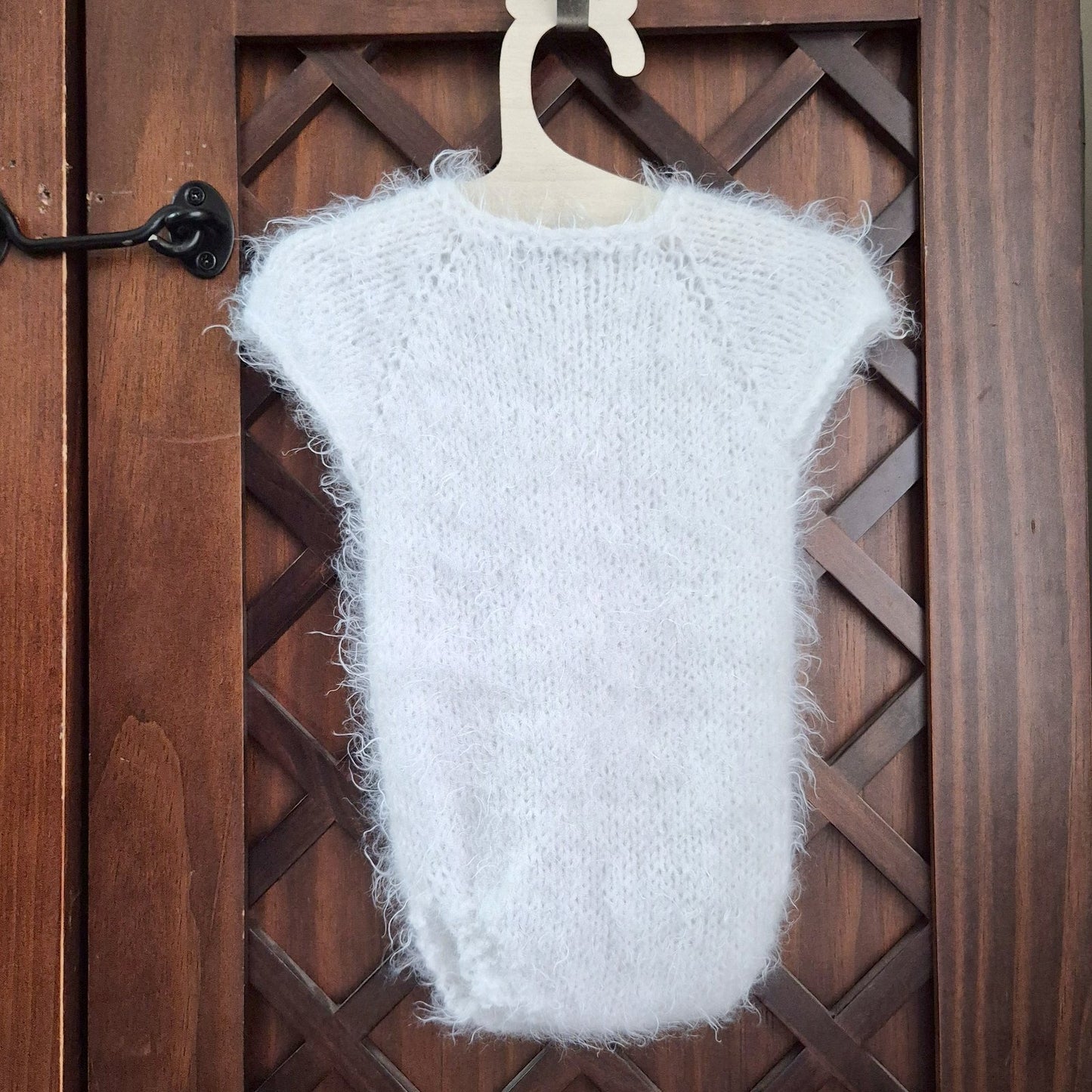 RTS ready to send knitted newborn photography prop romper. Hand made in super soft and fluffy white yarn. The romper is short sleeved, perfect for summer photo shoots.&nbsp;