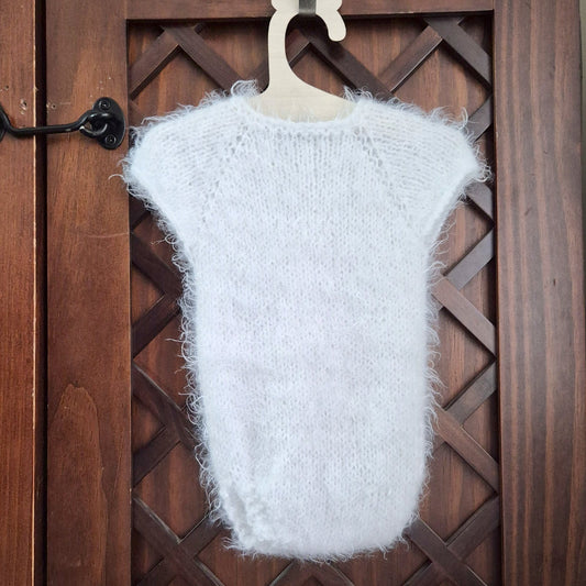 RTS ready to send knitted newborn photography prop romper. Hand made in super soft and fluffy white yarn. The romper is short sleeved, perfect for summer photo shoots.&nbsp;