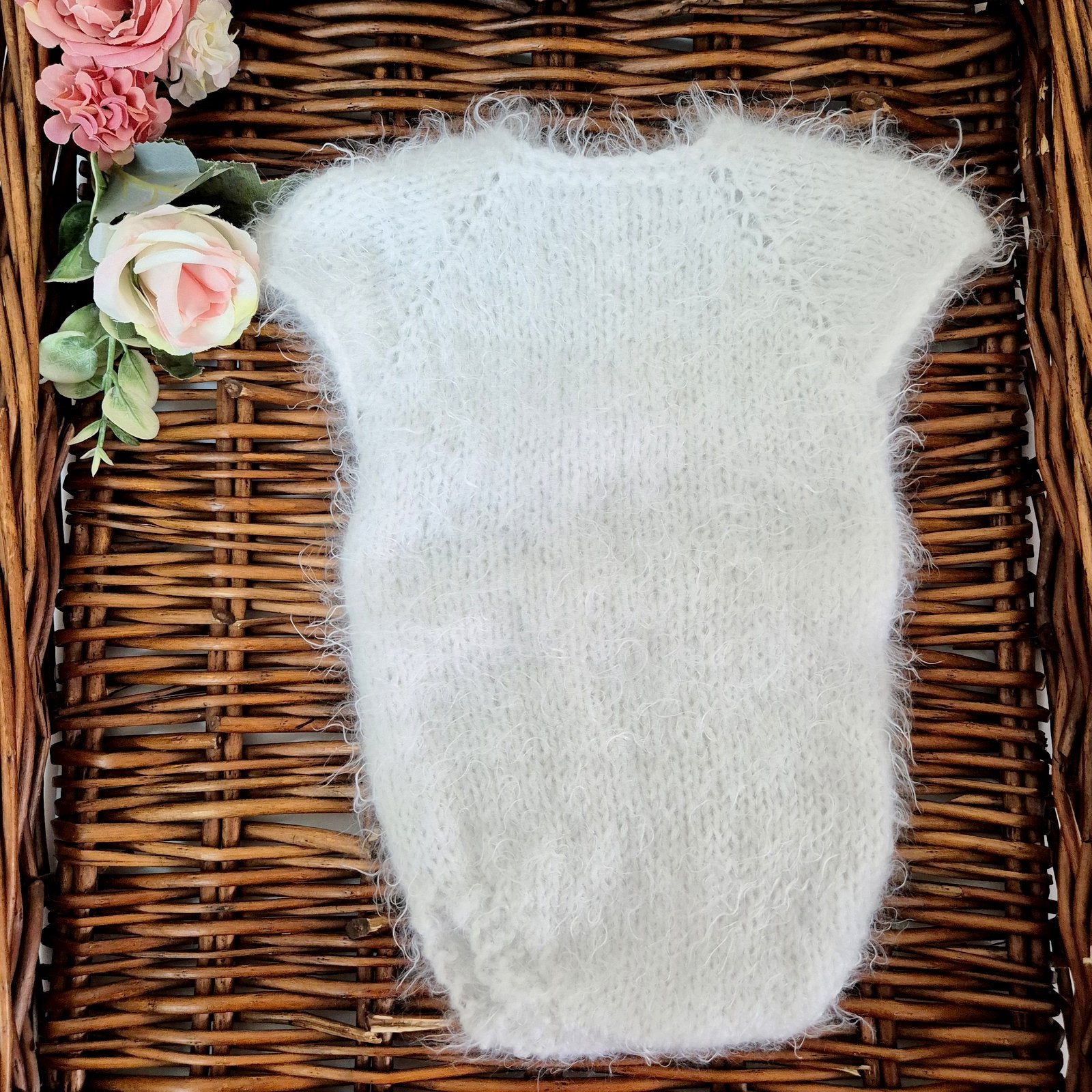 RTS ready to send knitted newborn photography prop romper. Hand made in super soft and fluffy white yarn. The romper is short sleeved, perfect for summer photo shoots.&nbsp;