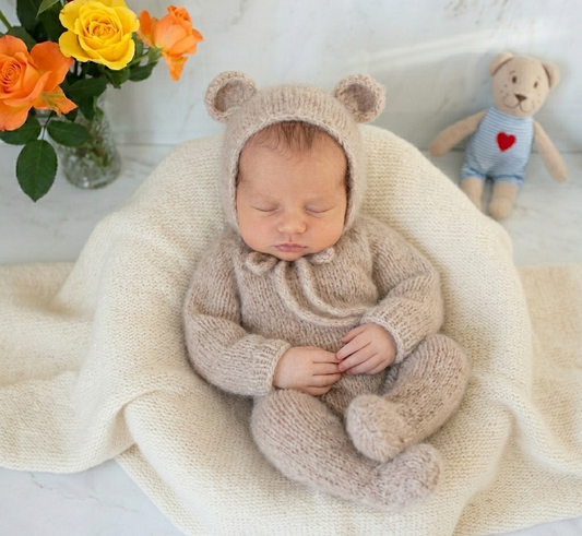 Handknit baby Bear Footed overalls outfit, for use as a photography prop for newborn to 3 months&nbsp; babies.

This handmade bear suit is knit with long sleeves, and legs with 'feet, with buttons down the front.
