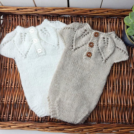 knitted newborn romper with leaf pattern in white or beige more colours available