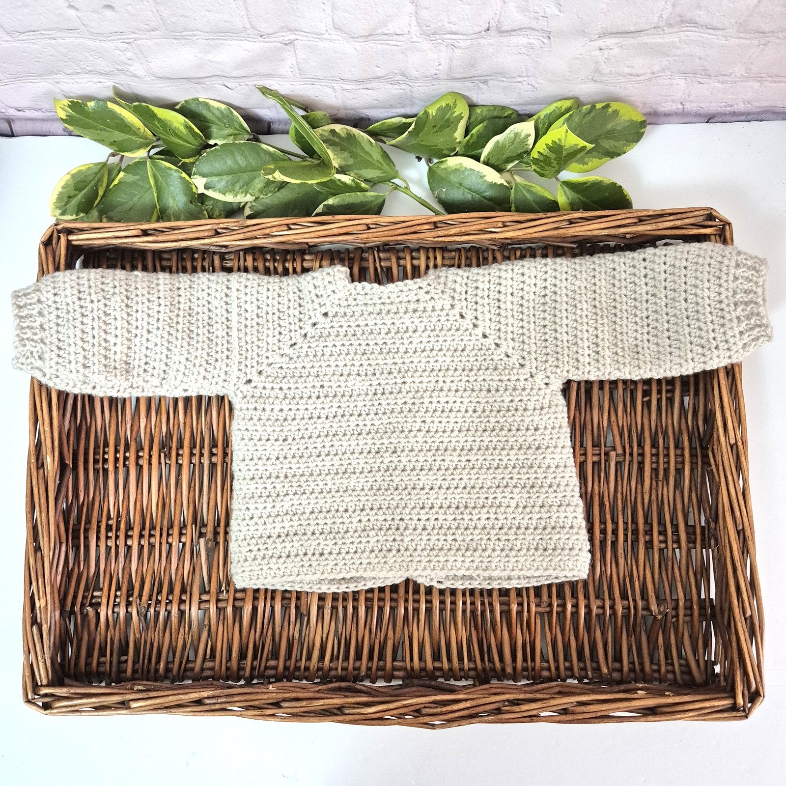 A gorgeous handmade crochet baby cardigan to fit a baby of 0-6 months This little jumper has coconut shell buttons and little toadstools embroidered on the front. 