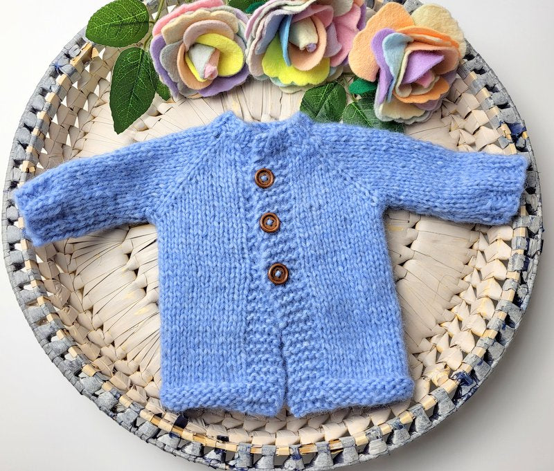 knitted baby jumper in blue