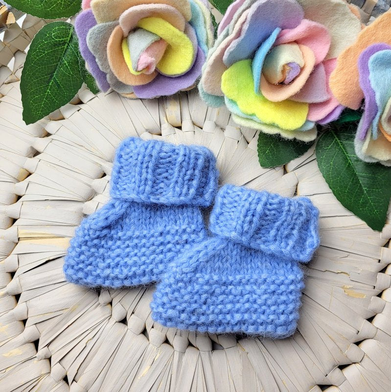 knitted baby booties in blue