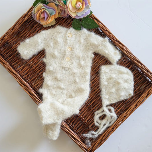 popcorn bubble pattern long sleeved footless newborn romper for use during a photo shoot