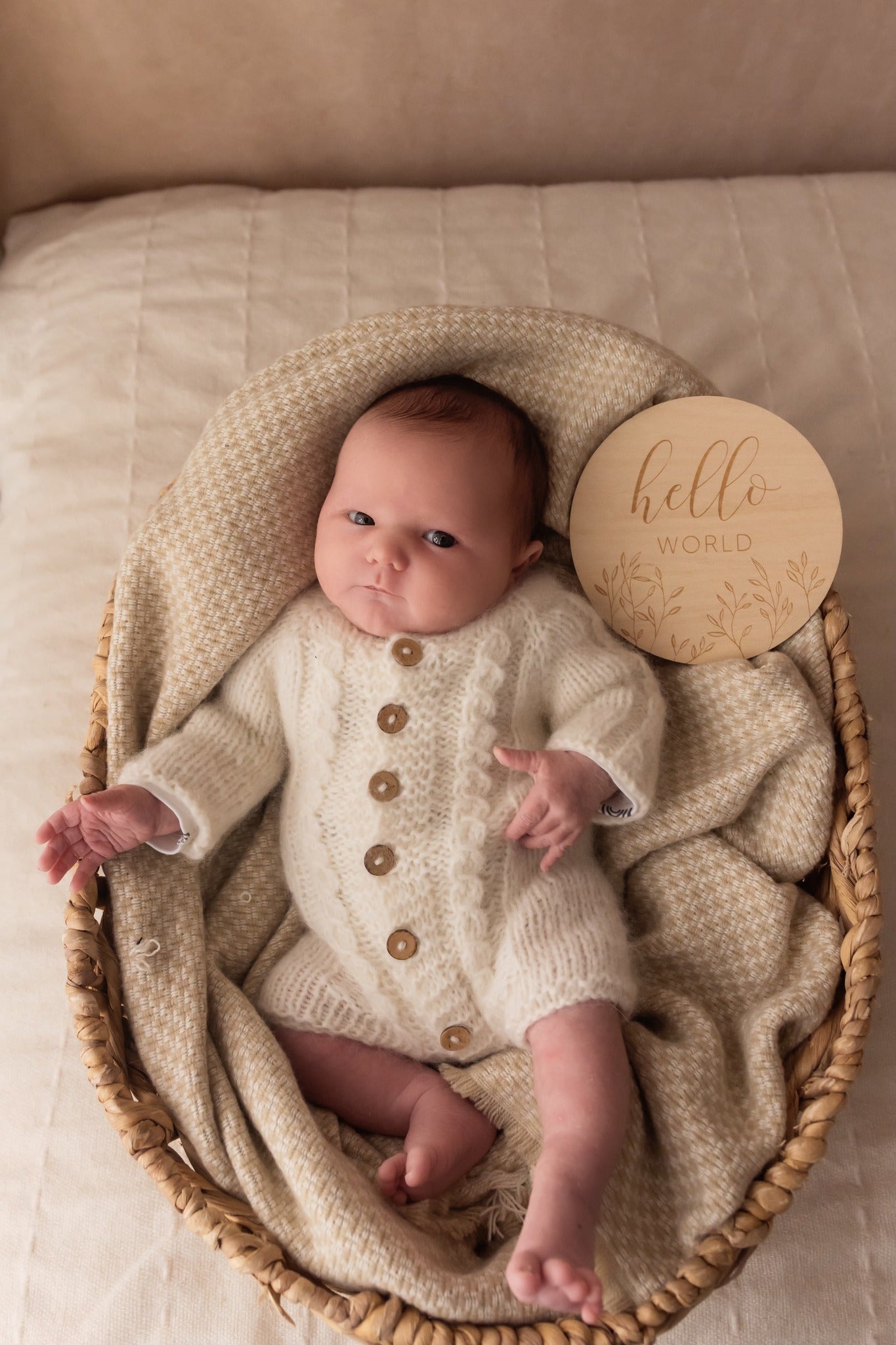 Hand Knit baby romper and bootie set. This darling little romper, has long sleeves, and buttons down the front. Little cables are knit into the sleeves, and down the front too. A matching pair of booties completes the set. Knitted in soft cream alpaca yarn, that is gentle on baby skin, and does not cause allergies.
Perfect as a hospital coming home outfit, newborn photography prop, or baby shower gift. 
It will be shipped to you in a white organza bag, all ready to gift to a new mama.