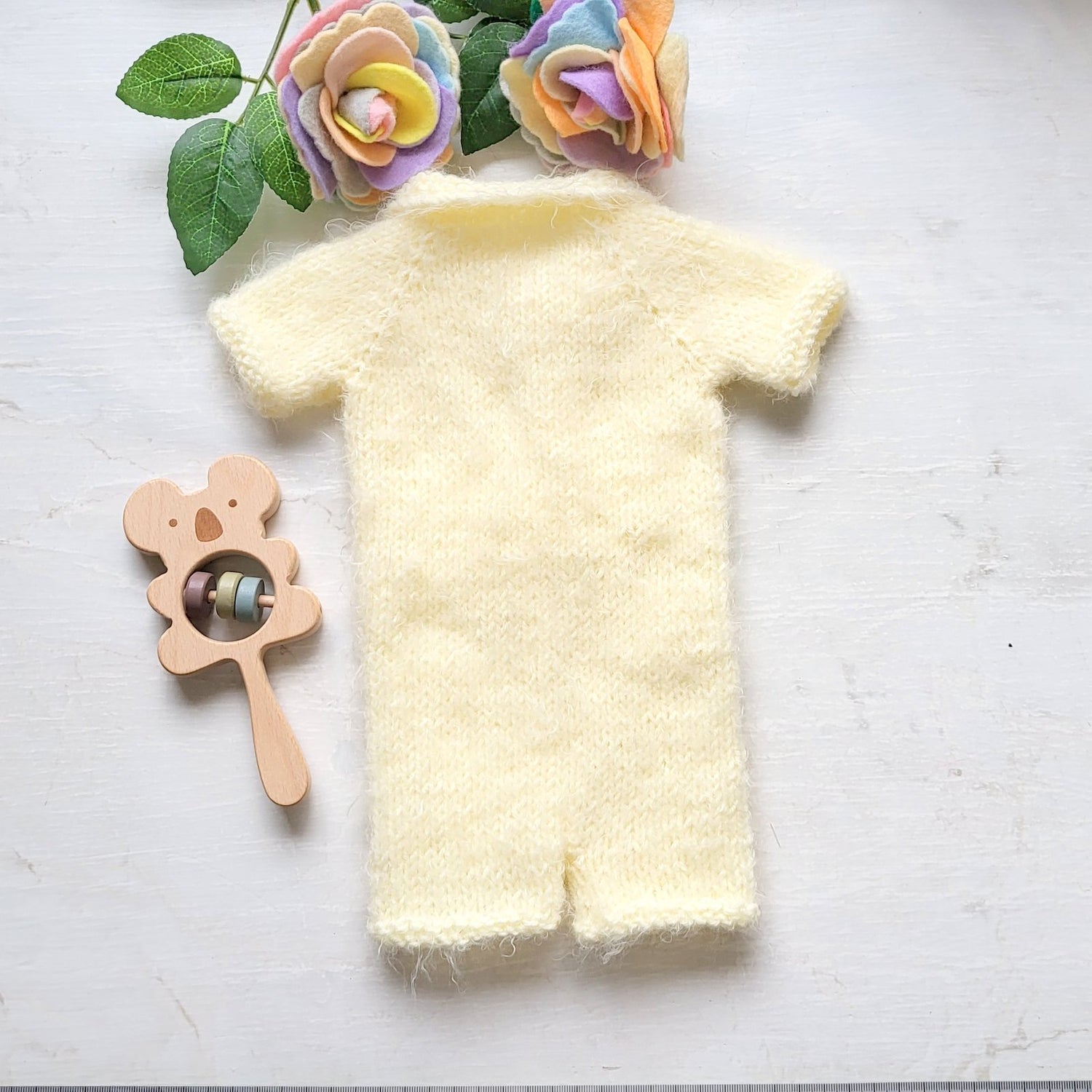 handmade knit baby romper in cream