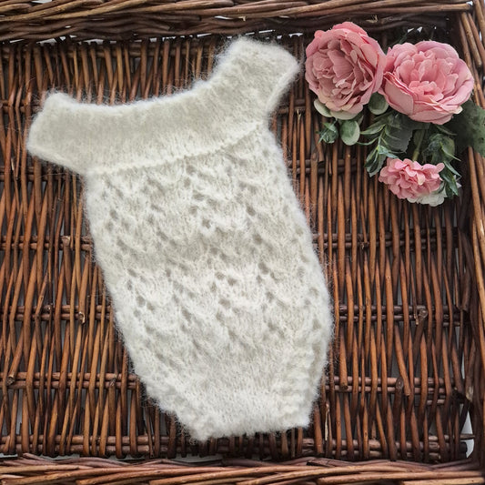Ready to send soft fluffy cream newborn romper. A sleeveless baby girl romper for your babys first newborn photos. The little romper has a wide shoulder neckline, with gorgeous all over lace pattern , just beautiful for a photo shoot.