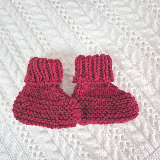 red knitted baby booties
