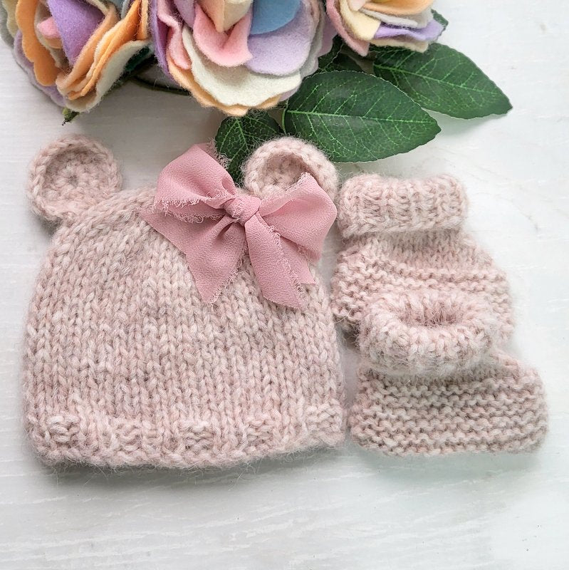 pink knitted baby bear hat with bow and matching booties