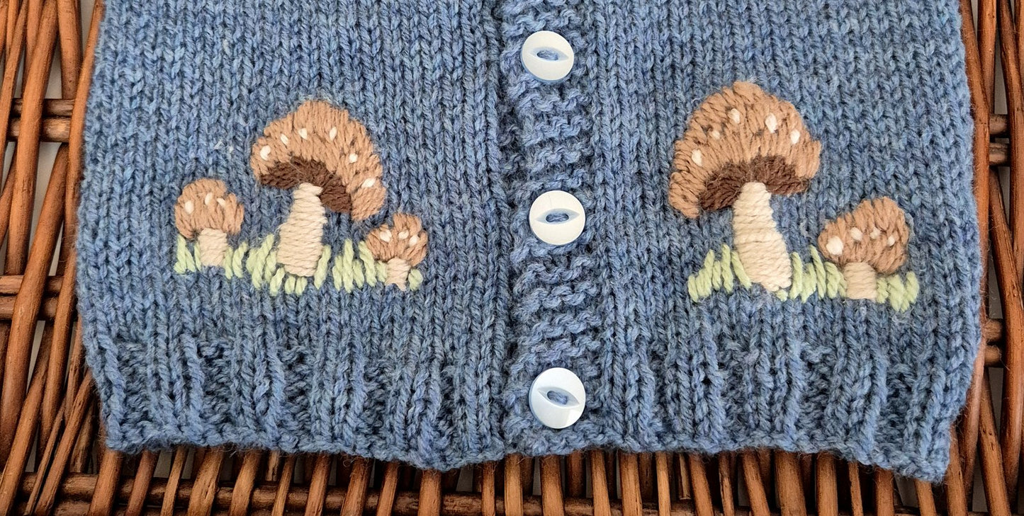 Knitted cardigan with mushroom pattern on a woven surface
