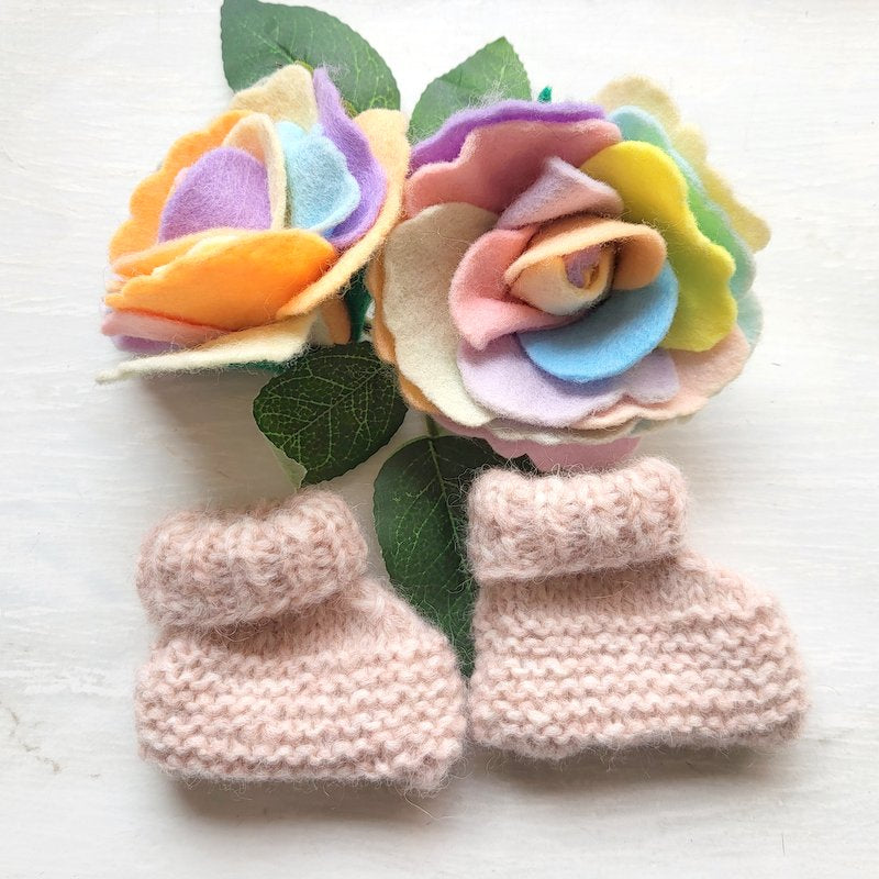 pink knitted baby booties
