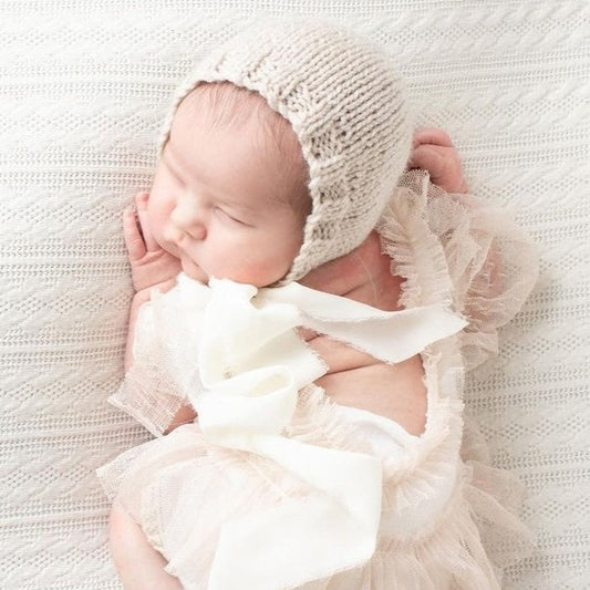 beige cream knit newborn bonnet with long ribbon ties 