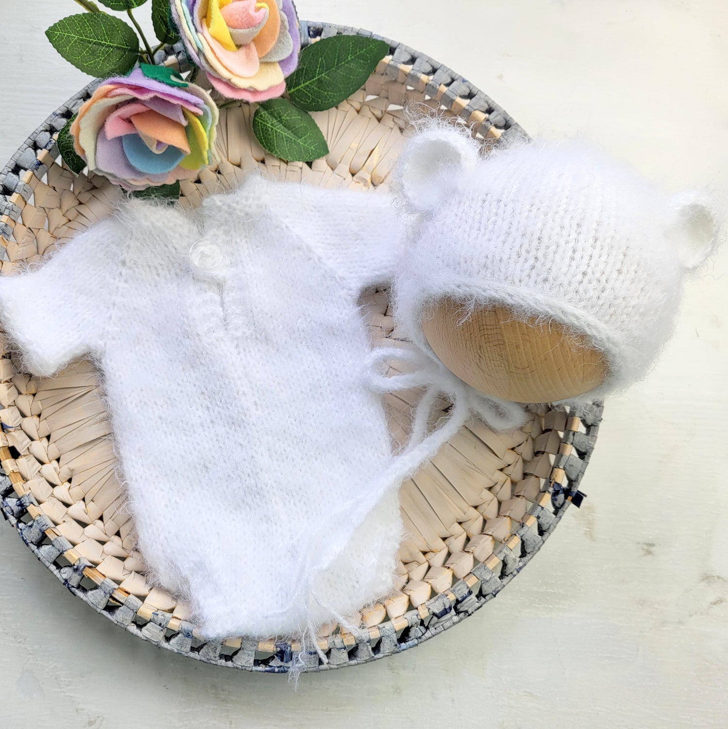 white knitted baby bear romper with short sleeves and a matching bear ears bonnet