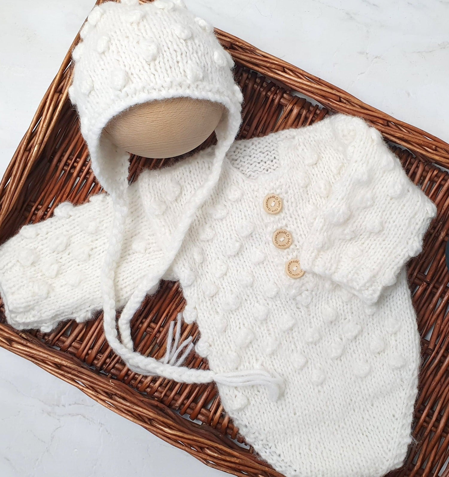 cream popcorn bobble pattern romper with longsleeves and matching bonnet in lusury alpaca yarn